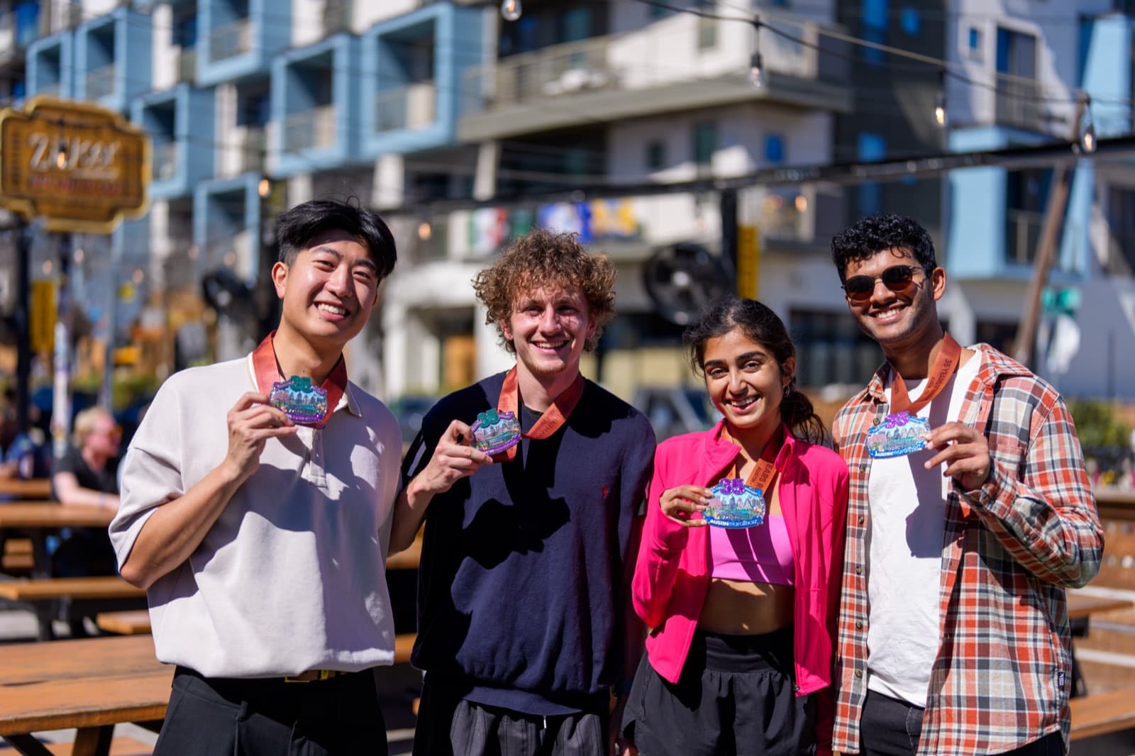 Stride & Rise members with medals in Austin